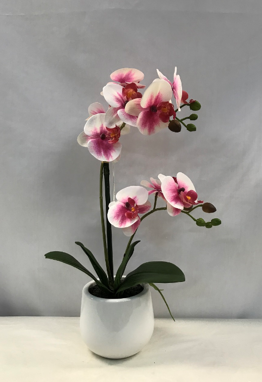 Artificial orchid in a variegated pink vase, height 35 cm